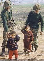 Unmindful of the heightened tension, children mingle with jawans at Dagg village