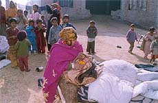 Geetu wraps up her baby to protect him from the cold.