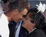 US golfer Tiger Woods receives a traditional Maori welcome from Glenys Turu, a member of a cultural group from the Te Wananga O Raukawa University, upon his arrival at Wellington airport early on Tuesday. Woods is playing in the New Zealand Open in Wellington.