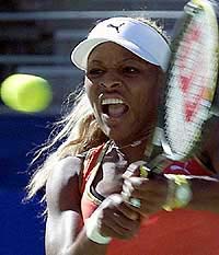 Serena Williams of the U.S. hits a backhand during her match against Russia's Anna Kournikova at the Sydney International tennis tournament on Tuesday.