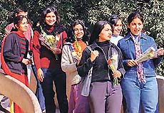 ALL FRAGRANCE AND SMILES: With beautiful roses in hands, the girls at Panjab University flash vibrant looks on the celebration of flower day organised by Panjab University Students Council on Thursday.