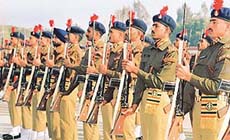 Recruits of the 57th condensed course present arms during their passing-out parade held at the Indo-Tibetan Border Police Force�s Basic Training Centre at Bhanu near Chandigarh on Saturday.