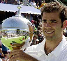 American tennis player Pete Sampras holds the winners trophy after defeating fellow American Andre Agassi in the final of the Kooyong International in Melbourne on Saturday. 