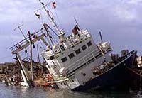 A Palestinian naval boat which President Yasser Arafat uses lies stricken on Saturday in a Gaza City port 