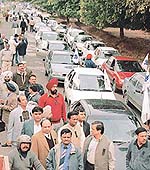 Members of the Chandigarh Beopar Mandal take out a rally on Tuesday in protest against the introduction of paid parking in Sectors 17, 8 and 9.