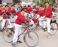 Students of DAV School, Sector 8, Chandigarh, rush out of the school on their cycles after school gets over on Tuesday.