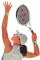 Switzerland's Martina Hingis serves during her second round