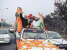 The newly elected president of the District Congress Committee, Mr Krishen Kumar Bawa, is taken in a procession to the Congress Bhavan in Ludhiana on Thursday.