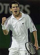 Britain's Tim Henman plays a forehand volley