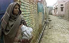 A woman looks toward an empty street