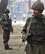 Border Security Force men keep guard on a street