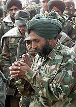 Indian soldiers take part in a memorial service