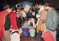 Residents of Sector 46-C queue up for drinking water on Sunday night in Chandigarh.