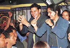Punjabi pop singer Gursewak Mann dances with fans at a disco in Chandigarh on Sunday.