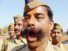 A policeman gives command during a rehearsal for the Republic Day parade