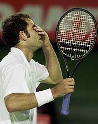 Pete Sampras of the United States reacts after missing a shot