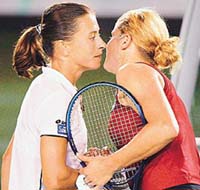 Kim Clijsters (R) of Belgium and Jenette Husarova of Slovakia greet at the net