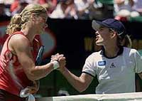 Belgium's Justine Henin congratulates compatriot Kim Clijsters 