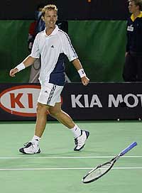 Sweden's Thomas Johansson's racquet lands on the court