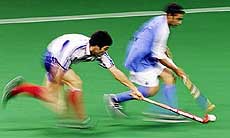 New Zealand's Mitesh Patel is challenged by Japan's Daisuke Hokaze