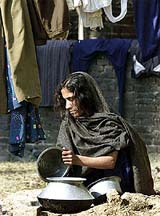 A woman, displaced because of the recent border clashes with Pakistan