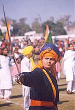 A school girl performs the traditional gatka at the Baba Deep Singh birth anniversary celebrations.