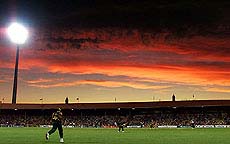 South Africa's Makhaya Ntini (L) runs in to field