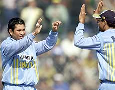 Sachin Tendulkar celebrates with Hemang Badani