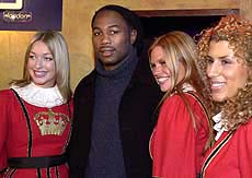 Britain's Lennox Lewis the WBC and IBF World heavyweight champion enters his press conference