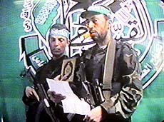 Picture taken from TV shows the two Hamas gunmen