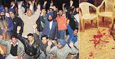 Supporters of a Shiromani Akali Dal candidate raise slogans against the Congress for an alleged attack on a person in the SAD election office in Naya Gaon on Friday and (right) stains of the blood of Kaka Singh, who was stabbed.
