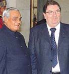 John Hume of Ireland with Prime Minister A.B. Vajpayee after receiving the Gandhi Peace Prize