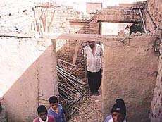 A view of the collapsed roof of a house at Bhattian village which left seven persons hurt. 