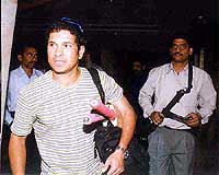 Indian cricket super Star Sachin Tendulkar, with armed policemen