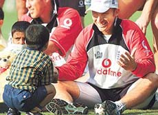 England�s captain Nasser Hussain plays with children suffering from cancer 