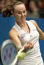 Swizerland's Martina Hingis makes a forehand return against Silvia Farina Elia 