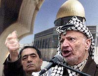 Palestinian President Yasser Arafat speaks during a meeting with his supporters in the West Bank City of Ramallah 
