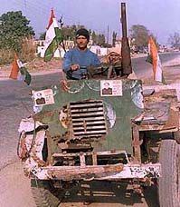 A Congress worker campaigns for the party on his tractor in Jalandhar.