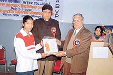 Balwinder Kaur, a student of SDP College for Women, receives the first prize in an inter-college debate competition organised by the Akhil Bharatiya Vidyarthi Parishad in Kamla Lohtia Sanatan Dharam College on Tuesday. 