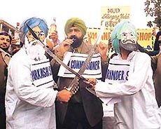 Jaspal Bhatti, the fake election commissioner, asks the candidates to begin the mud-slinging match at a street play organised by Nonsense Club in Sector-17, Chandigarh, on Tuesday.
