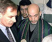 British Defence Secretary Geoff Hoon (left) talks to the media as Afghanistan�s interim leader Hamid Karzai listens