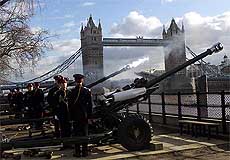 A tongue of flame and smoke spout from one of the canons as members of the Honorary Artillery Company fire a 62 gun salute 