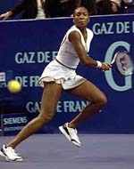 Venus Williams of the USA chases down the ball