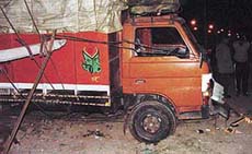 The damaged truck with snapped electricity cables, after it rammed into an electricity transformer near Hallo Majra village on Saturday.