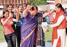 The Principal of Home Science College, Sector 10, Chandigarh, dances with students at their annual fete on Saturday.