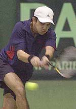 Harsh Mankad returns a ball