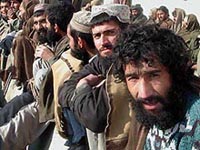 Freed Taliban prisoners line up at the International Red Cross centre