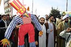 Demonstrators celebrating Iran's national day carry an effigy of Uncle Sam to Tehran's Azadi Square on Monday.