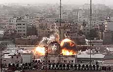 An explosion is seen in the building that houses the Palestinian Public Security Directorate