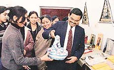 Can I hold it? Asks chief guest, Mr K.A.P. Sinha, DPI (Colleges) and Joint Secretary Finance, UT, at an art exhibition in Government College for Girls, Sector 11, Chandigarh, on Tuesday.